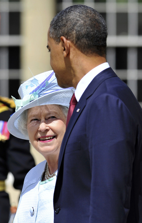 President Barack Obama and Queen Elizabeth attend the ceremony for the national anthems at Buckingham Palace in London today.