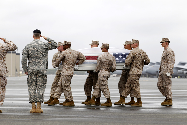 A Marine team carries the remains of Marine Sgt. Kevin B. Balduf of Nashville, Tenn., upon arrival at Dover Air Force Base, Del., on Saturday. Balduf was married to a woman from Richmond, Maine.