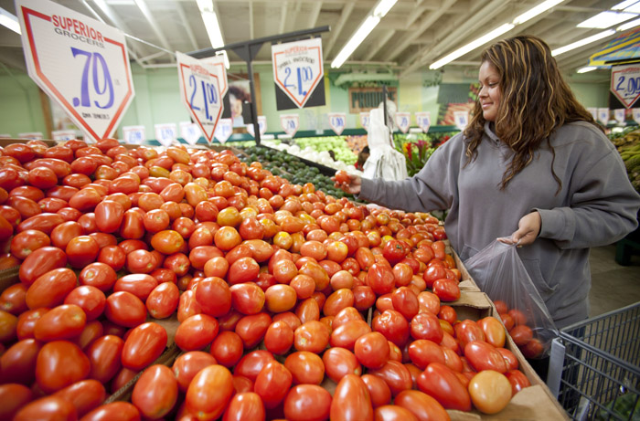 Sonia Romero shops recently for tomatoes at a Superior Grocers store in Los Angeles. A monthly survey shows consumers are losing faith that the economy will keep improving.