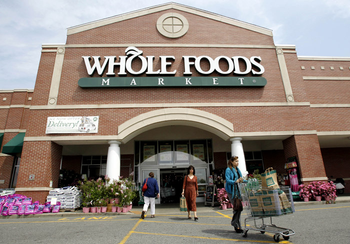 Shoppers depart a Whole Foods Market store in Providence, R.I., recently.