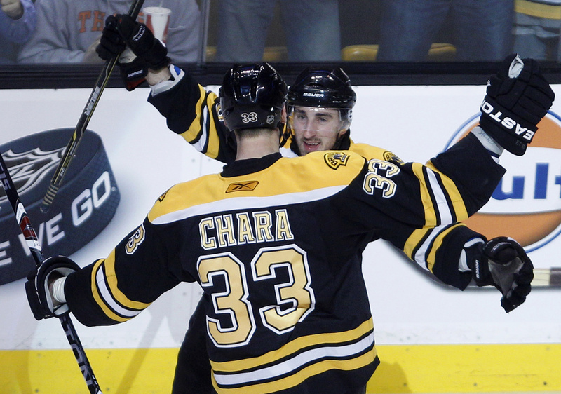 Zdeno Chara is congratulated by Brad Marchand after his first-period goal tonight against the Flyers in Game 3 of the Eastern Conference semifinals at Boston. The Bruins won 5-1 and lead the series, 3-0.