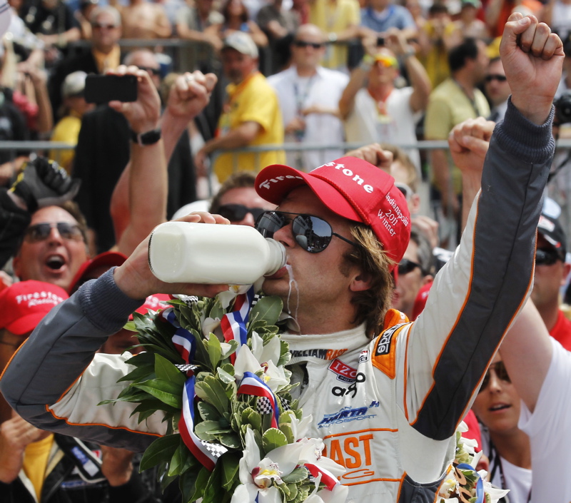 IndyCar driver Dan Wheldon drinks from a bottle of milk after winning the Indianapolis 500 auto race at the Indianapolis Motor Speedway in Indianapolis today.