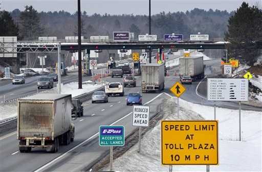 FILE - In this Feb. 2011 file photo, traffic approaches Maine Turnpike toll booths in Gardiner, Maine. A legislative committee is suggesting cutting Maine Turnpike Authority board terms from seven years to four. The authority is under scrutiny after an audit uncovered thousands of dollars in lavish expenses and gift cards. (AP Photo/Robert F. Bukaty, File)