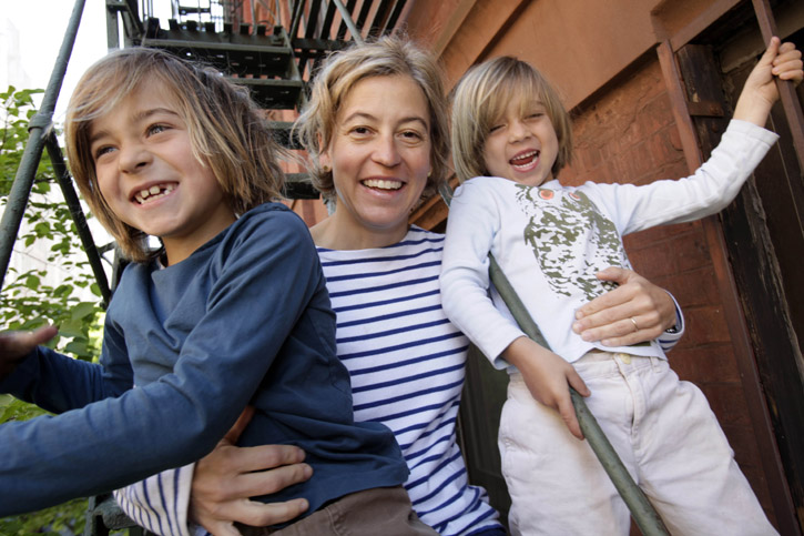 Amy Richards with her sons Webber Sloan, 7, left, and Beckett Sloan, 5, on a fire escape at their apartment in New York. Richards is a feminist activist and author of "Opting In: Having a Child Without Losing Yourself." A former college soccer player, Richards is pleased that her sons are good athletes, but also is wary of lapsing into gender stereotypes.