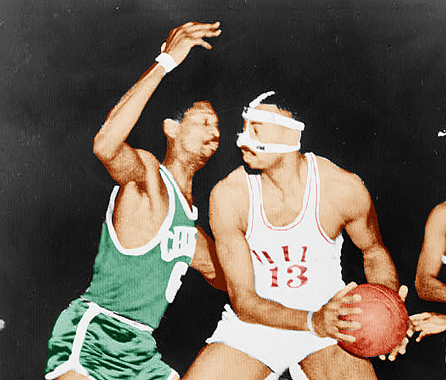 Bill Russell guards Wilt Chamberlain during a basketball game in the 1960s.