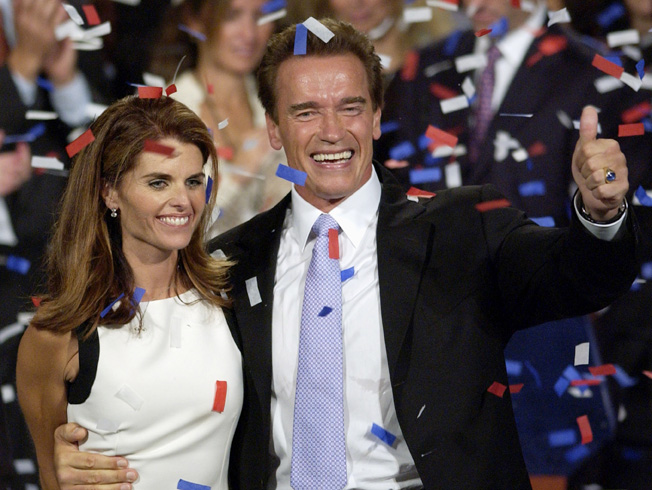In this Oct. 7, 2003, file photo former California Governor Arnold Schwarzenegger and his wife Maria Shriver celebrate his victory in the California gubernatorial recall election.