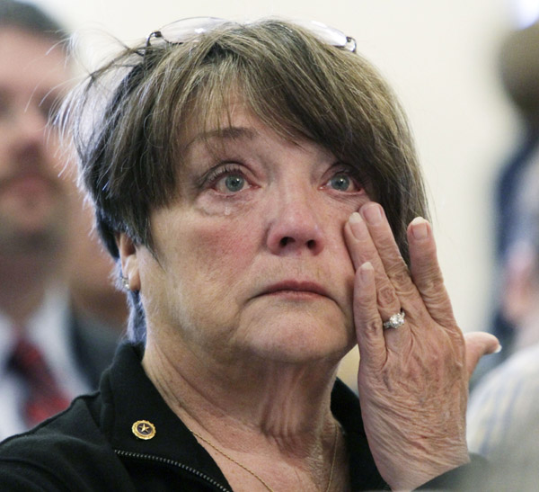 Marnie Gardner, of Greene, wipes tears from her eyes during the ceremony to honor Mainers who gave their lives in Iraq and Afghanistan, at the State House in Augusta, today. Gardner's grandson, Cpl. Andrew L. Hutchins, of New Portland, Maine died on Nov. 8, 2010, in Afghanistan.