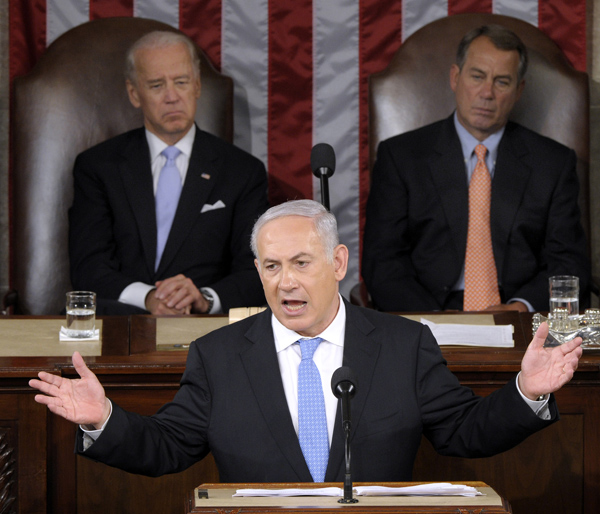 Israeli Prime Minister Benjamin Netanyahu addresses a joint meeting of Congress on Capitol Hill today. Behind him are Vice President Joe Biden, left, and House Speaker John Boehner of Ohio, right.