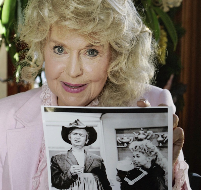 Donna Douglas, who starred in the television series "The Beverly Hillbillies," poses with a photo from the show in Baton Rouge, La.