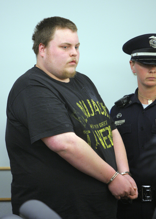 Gregory Rec/Staff Photographer: Trevor Ferguson, 23, is led in to Ossipee District Court in Ossipee, New Hampshire on Wednesday, May 11, 2011. Ferguson was arrested and arraigned in connection with the death of Krista Dittmeyer.