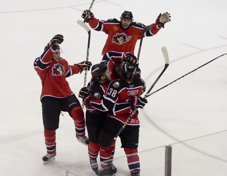 Tim Conboy is mobbed by teammates after scoring what turned out to be the winning goal for the Pirates.