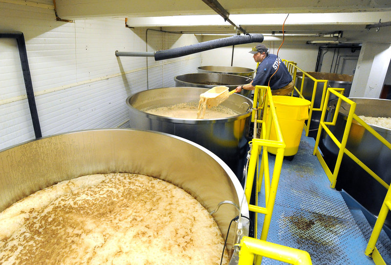 Brewer Erick Christensen strips yeast from a fermenter at Shipyard Brewing in Portland. The company is looking to expand its Florida market to keep production stable year-round.