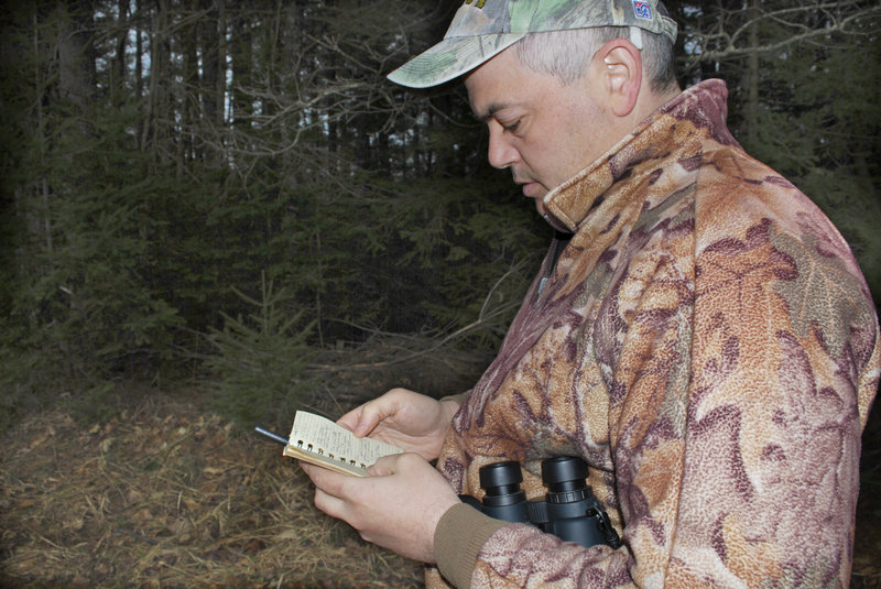 Joe Saltalamachia makes notes about birds he spotted while scouting in Unity.