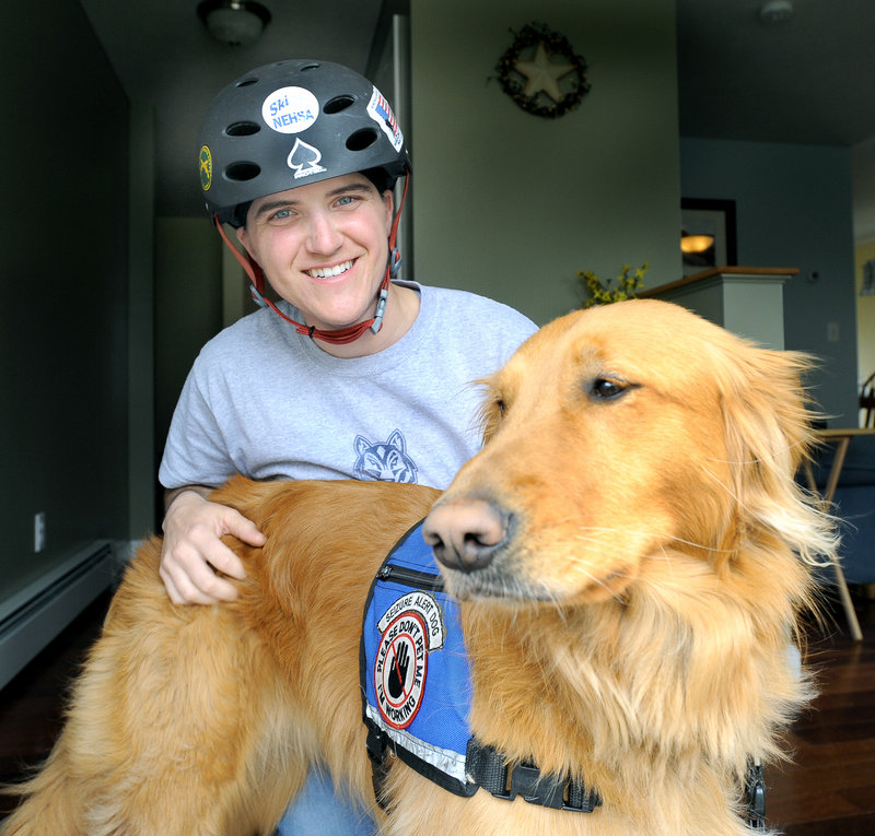 Christy Gardner with her service dog “Moxie” at her home in Lewiston. Moxie is on duty 24 hours a day, seven days a week, watching out for Gardner’s safety.