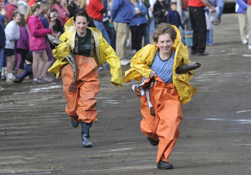 Rick Hilscher, a fifth-grader at Boothbay Regional Elementary School, edges ahead of seventh-grader Angela Machon in the "small fry" cod relay.