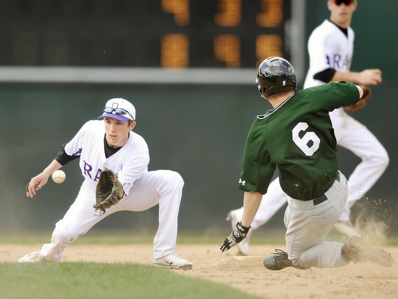 Matt Bevilacqua of Deering concentrates on the ball before applying a tag on Evan Spencer of Bonny Eagle, who was attempting to steal second.