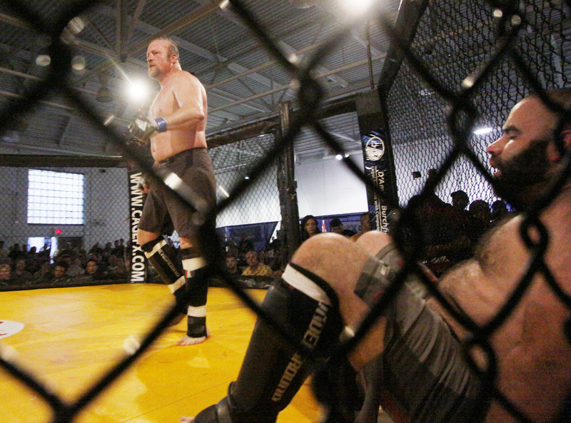 Kevin Armstrong, left, of Team Irish struts his stuff after defeating Greg Armstrong of the Bishops. Eighteen months after the sport was sanctioned in Maine, the fights began.