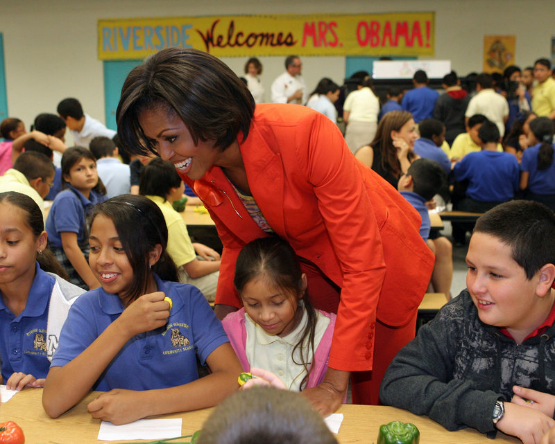 Michelle Obama talks to fifth-graders at Riverside Elementary in Miami in 2010 about the start of “Let’s Move Salad Bars to Schools.” The public health initiative was launched in support of “Let’s Move,” whose goal is to eliminate childhood obesity within a generation.