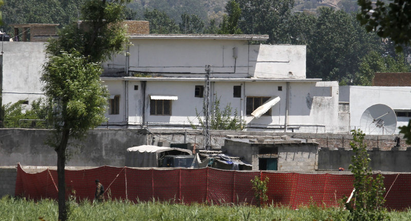 A Pakistani soldier stands near a compound where it is believed al-Qaida leader Osama bin Laden lived in Abbottabad, Pakistan, on Monday.