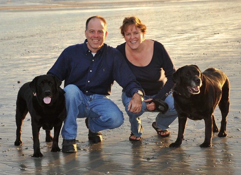 Lisa Ballou, John Torpie and their dogs, Marley and Katie, pose at Pine Point Beach in Scarborough in September 2010.