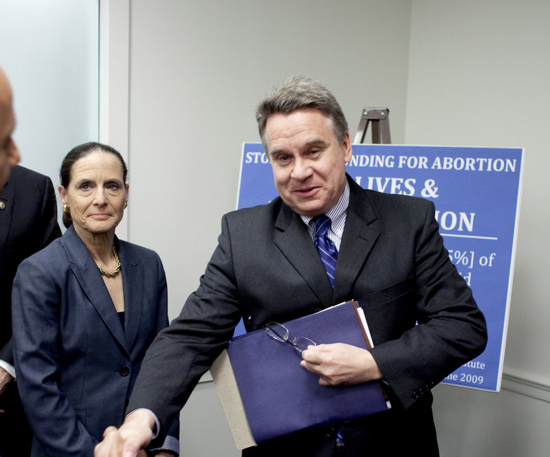 Rep. Jean Schmidt, R-Ohio, left, and Rep. Christopher Smith, R-N.J., arrive for a news conference on Capitol Hill in Washington Wednesday to discuss the No Taxpayer Funding for Abortion Act.