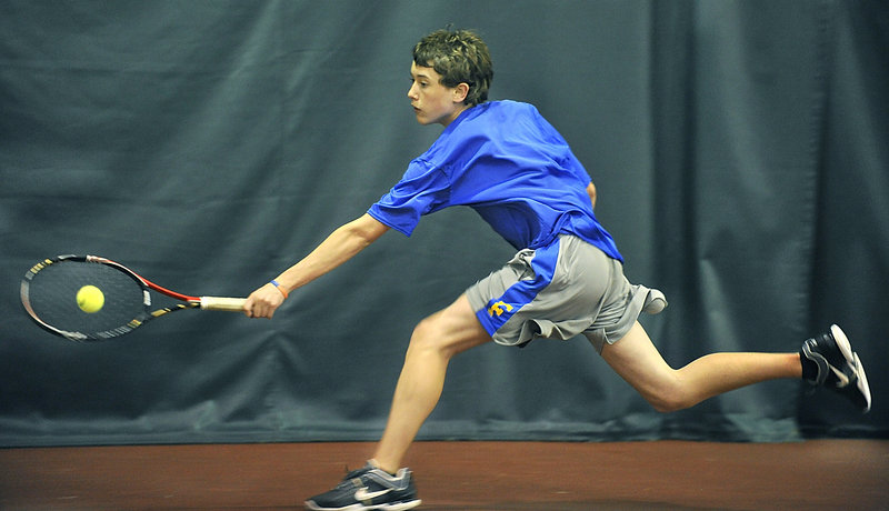 Brendan McCarthy of Falmouth stretches for a backhand return Wednesday against Ross Sherman of Cape Elizabeth. Falmouth swept the Capers, but every match between the top Western Class B teams was competitive.