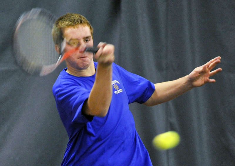 Tom Wilberg of Falmouth returns a shot during a doubles match against Cape Elizabeth. Either the Yachtsmen or Capers have been in nine of the past 10 state finals.