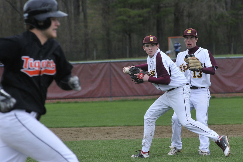 Jeff Gelinas of Thornton Academy sets to throw to first in an attempt to retire Nick Gagne of Biddeford, who reached on an infield single during their Telegram League game Thursday. Biddeford won 7-6 in nine innings. Sam Canales backs up.