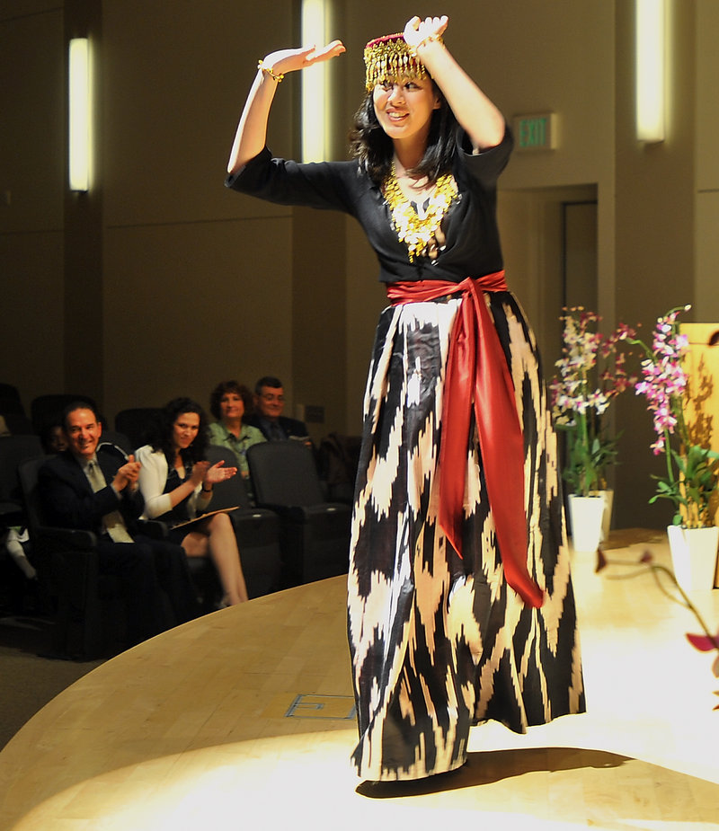 Malika Umarova, a student in the University of Southern Maine’s Muskie School of Public Service, performs a traditional Khorezm dance from Uzbekistan during the annual multicultural and international student graduation and recognition ceremony at USM’s Abromson Center on Thursday.