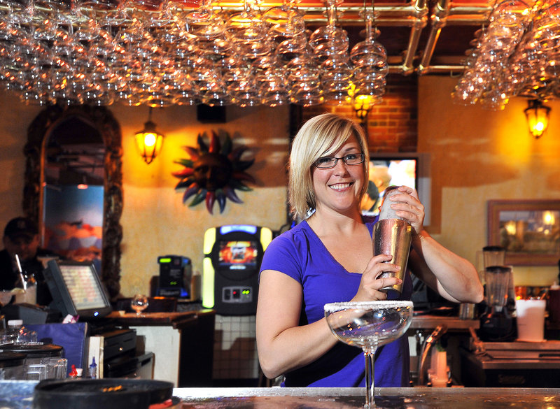 Bartender Amy Ridlon makes one of the many specialty margaritas available at Margaritas on Brown Street in Portland. The franchise serves 15 kinds of its signature drink.