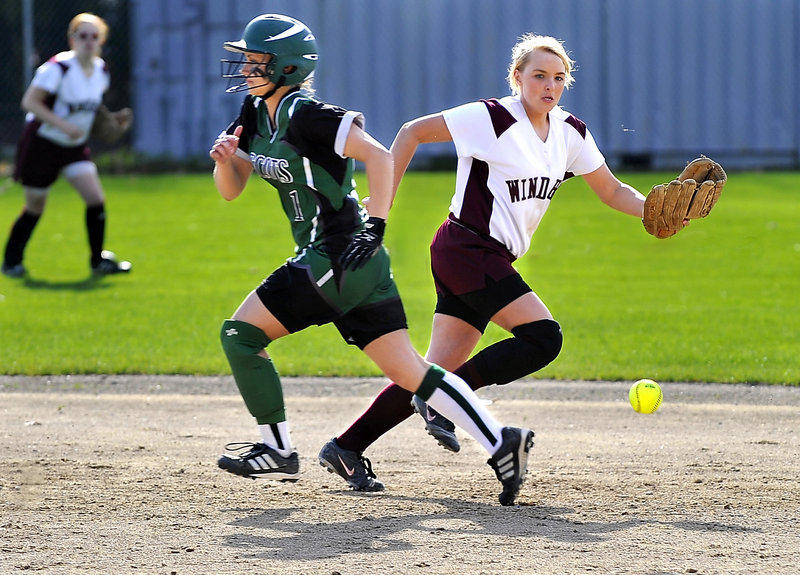 Brittany Murphy of Bonny Eagle is bound for third base as shortstop Billie Lamb of Windham chases down the ball.