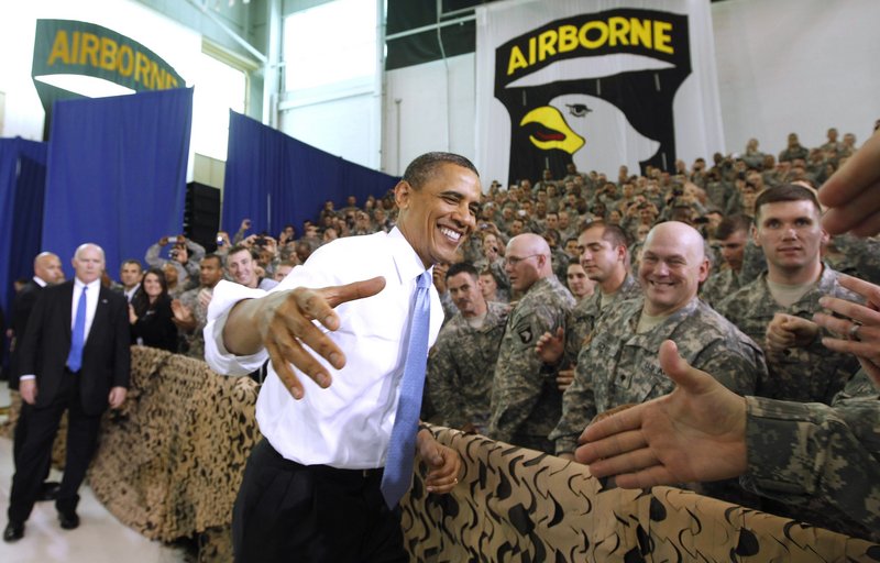 President Obama greets military personnel prior to addressing troops Friday at Fort Campbell, Ky. Obama also met privately with the commandos he sent after terror mastermind Osama bin Laden. Obama called the bin Laden raid one of the most successful intelligence and military operations in America’s history, and said he had to come to extend personal thanks. Obama said his meeting with special operations forces “was a chance for me to say on behalf of all Americans and people around the globe, job well done, job well done.” The identities of the men who killed bin Laden are likely to remain secret forever. White House officials released few details of Friday’s meetings and would not formally confirm whether Obama actually met members of Navy SEAL Team 6, whose existence is officially classified.