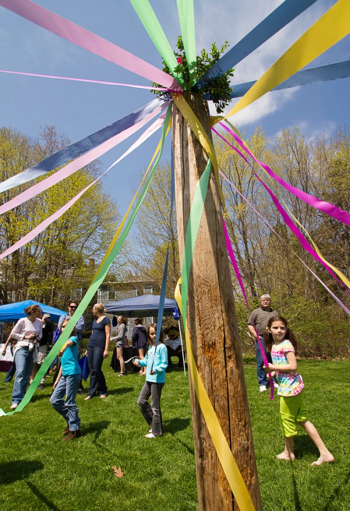 Young festival-goers dance around the maypole in Lafayette Park.