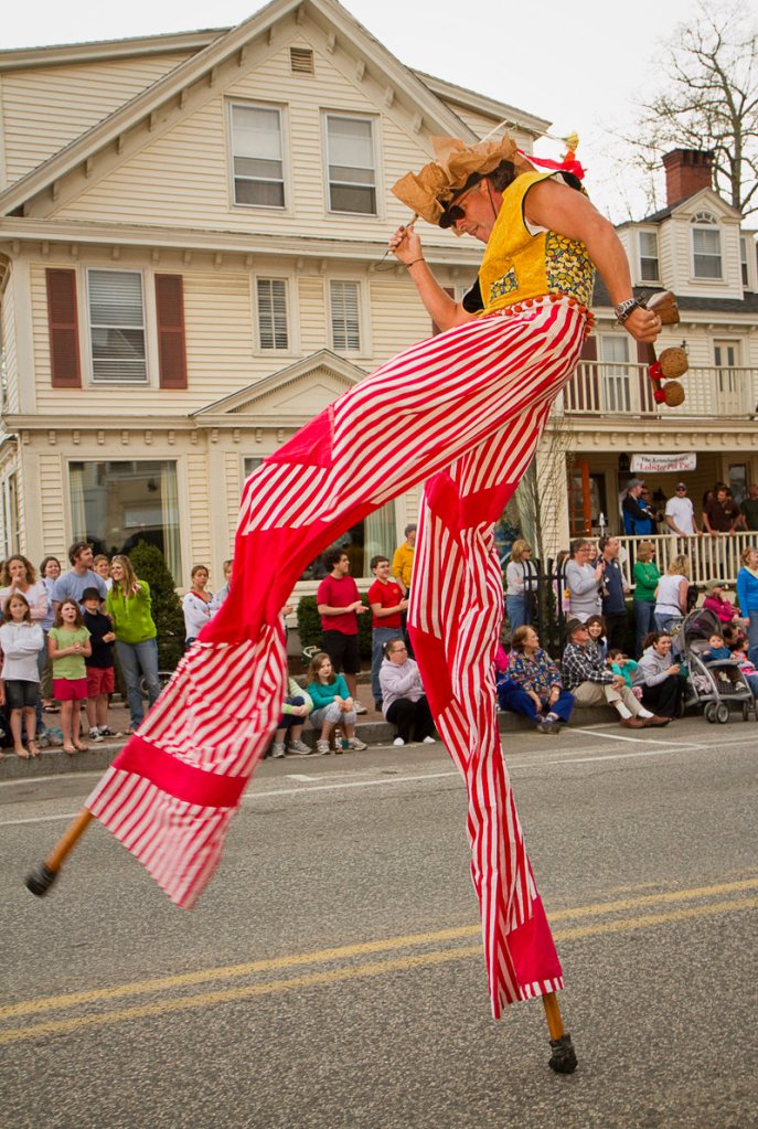 Greg Frangolis of Portland's Shoestring Theater performs on stilts during the festival parade.