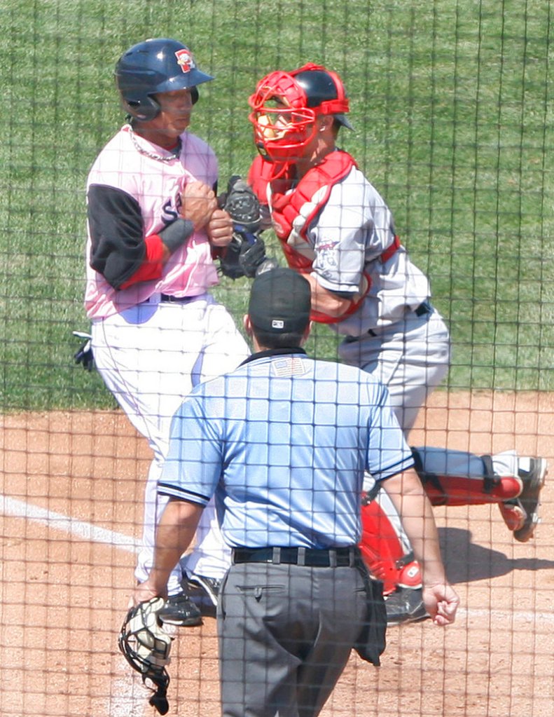 Daniel Rohlfing of the New Britain Rock Cats tags out Sea Dog Jorge Padron at home plate at Hadlock Field on Sunday.