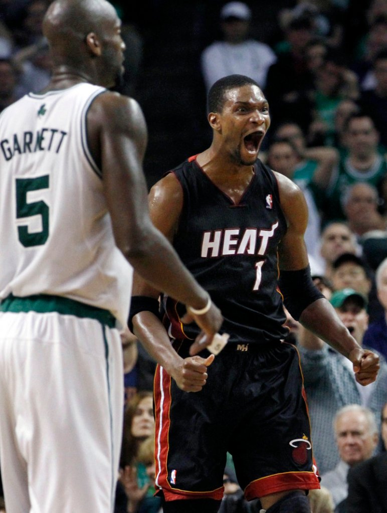 There’s no wondering how Miami’s Chris Bosh feels as the Heat take command late in overtime Monday night in Boston. Bosh scored 20 points for the Heat.