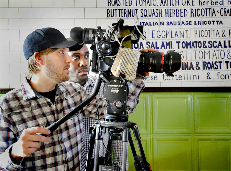 A film crew from No Regrets Entertainment – videographer Seth Marshall and producer Rasheed J. Daniel – frames a shot at the Otto pizza shop in Portland on Tuesday for a show called “Pizza Outside the Box,” to be aired on the Cooking Channel on Aug. 7.