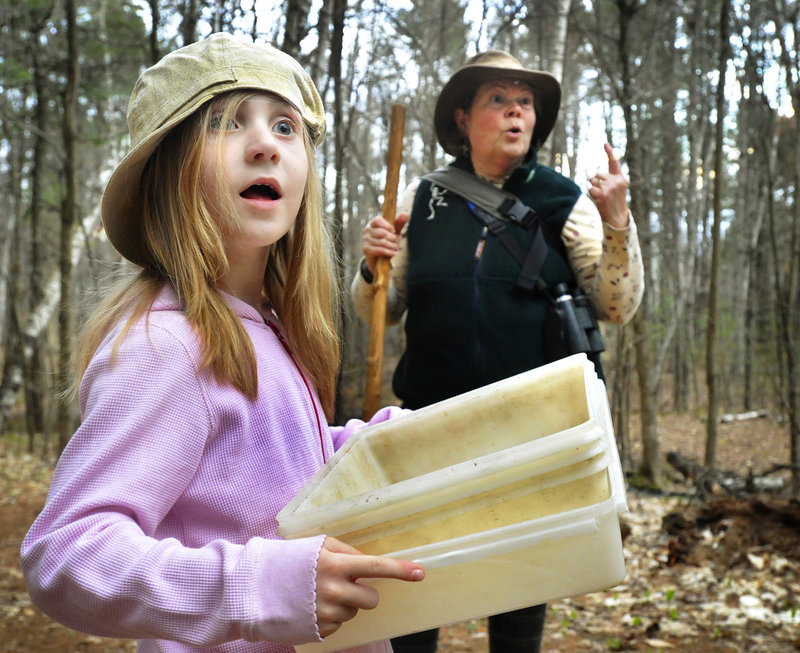 Adeline Runnels of Auburn pays attention as trip leader Susan Hayward points out the call of a barred owl.