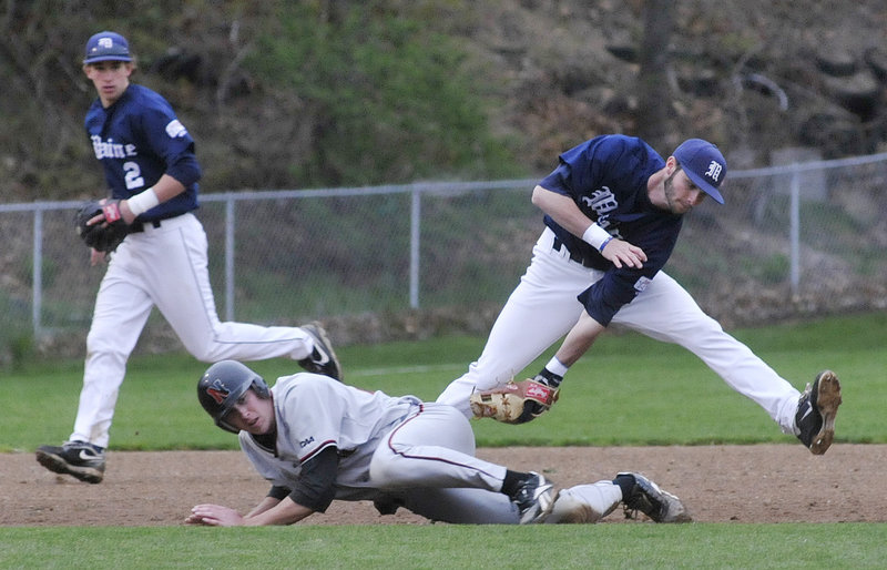 Maine third baseman Mike Connolly manages to tag out Northeastern's Tucker Roeder, who dives in an attempt to avoid it. Maine upped its winning streak to eight games by rallying in the ninth inning for a 5-2 victory Tuesday night at Goodall Park in Sanford.