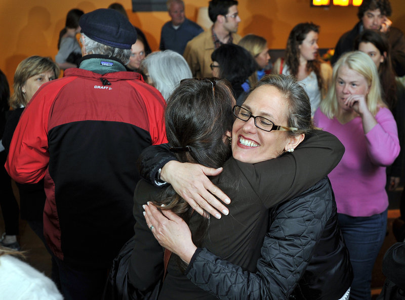 Cynthia Dill hugs a supporter as they share news of positive returns at The Buzz in Cape Elizabeth on Tuesday. Dill, a Democratic representative in the Maine House, beat the GOP’s Louis Maietta Jr. to fill a vacancy in Senate District 7.