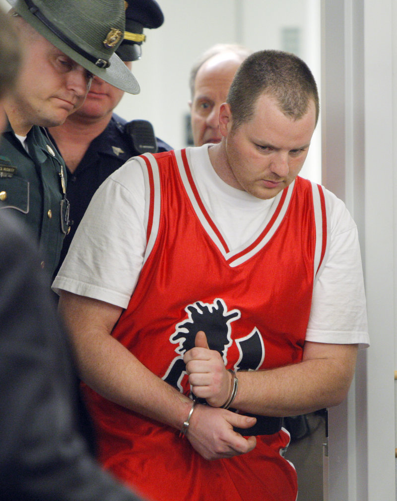 Anthony Papile is led Wednesday into Ossipee District Court in New Hampshire, where he was arraigned on a murder charge in the slaying of Krista Dittmeyer. Authorities said he ambushed Dittmeyer and struck her three times in the head with a rubber club.