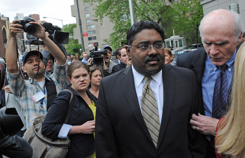 Raj Rajaratnam, co-founder of Galleon Group, exits court Wednesday in New York with his attorney Terence Lynam. Rajaratnam faces more than 19 years in prison.