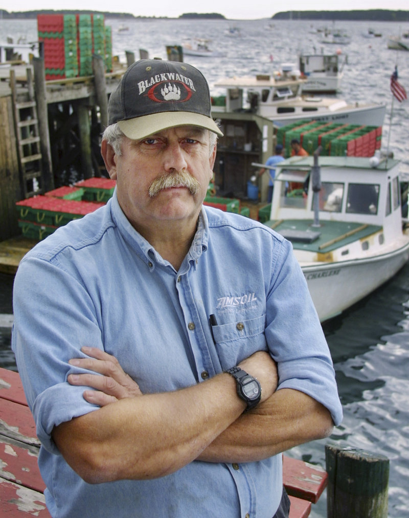 Lobsterman and former Navy underwater photographer Steve Waterman poses at a pier in South Thomaston in 2001. He said he has exposed more than 100 phony U.S. Navy SEALs over the years. “There were about 500 SEALs that operated in Vietnam, and I’ve met all 20,000 of them,” joked Waterman, author of the book “Just a Sailor.”