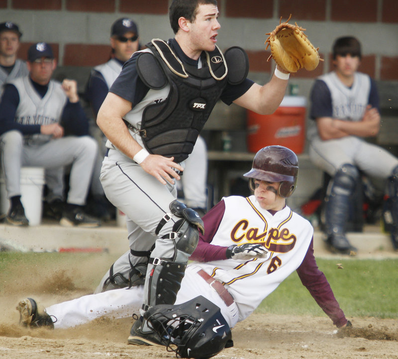 Ben Berman of Cape Elizabeth slides home as Nick Proscia of Yarmouth waits for the throw Wednesday in the fifth inning of the Capers 10-1 victory at home.