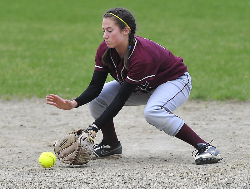 Nicole Lanoie of Noble stops a hard infield grounder during Wednesday's 4-3 loss to McAuley.