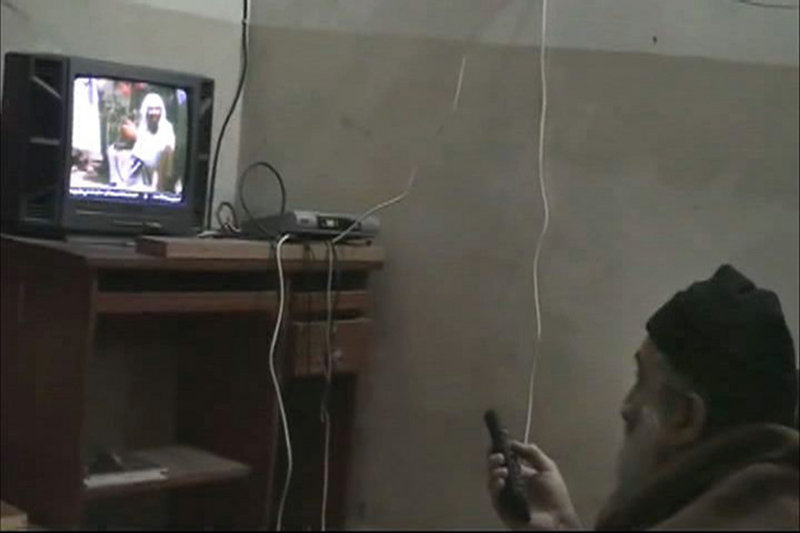 In this undated image from video seized from Osama bin Laden’s compound in Abbottabad, Pakistan, a man who the U.S. government identified as bin Laden watches himself on television.