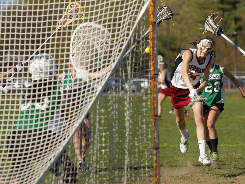Mia Rapolla of Gorham takes aim on the net Thursday during the second half of a 15-11 victory against Massabesic in schoolgirl lacrosse. The shot went in for one of Rapolla’s seven goals as the Rams remained undefeated.
