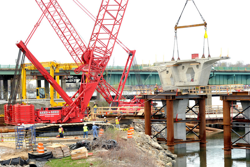Employees of Reed & Reed Inc. work on Portland’s new Veterans Memorial Bridge. The company employs about 200 people.