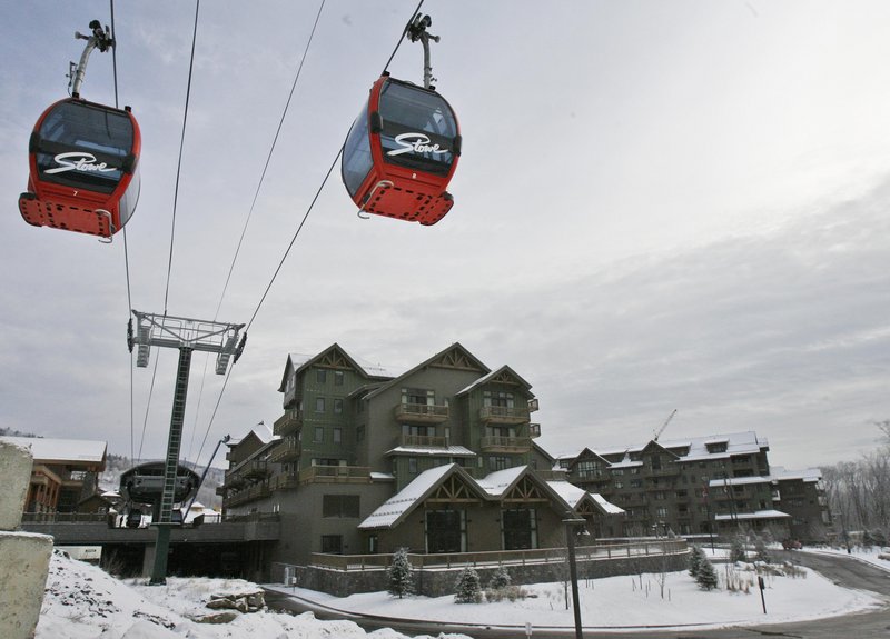 About 300 condo owners at the Stowe Mountain Resort are suing affiliates of American International Group, which owns the resort. Owners say they put down 20 percent deposits on units in 2005, but when changes in fees came just before closing in 2008, they weren’t given a chance to back out.