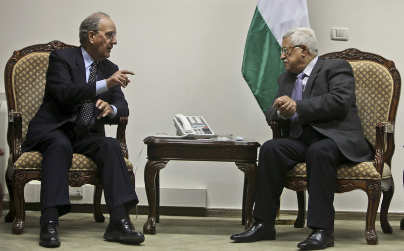 George Mitchell meets with Palestinian President Mahmoud Abbas at Abbas headquarters in the West Bank city of Ramallah in 2009 shortly after Mitchell was named Mideast envoy. He was seeking to prop up a Gaza cease-fire and restart broader peace talks.